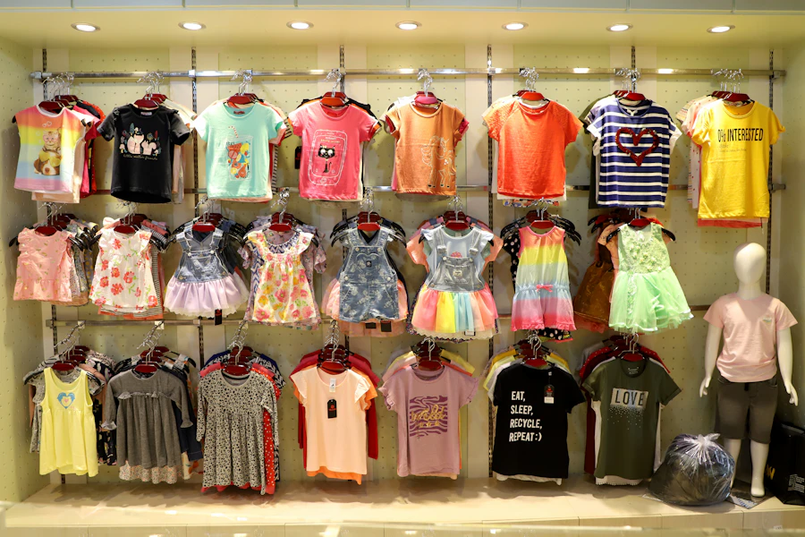 Children's clothing arranged on retail display racks